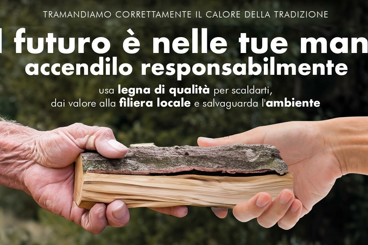 locandina dell'iniziativa, con due mani che si passano un pezzo di legna da ardere